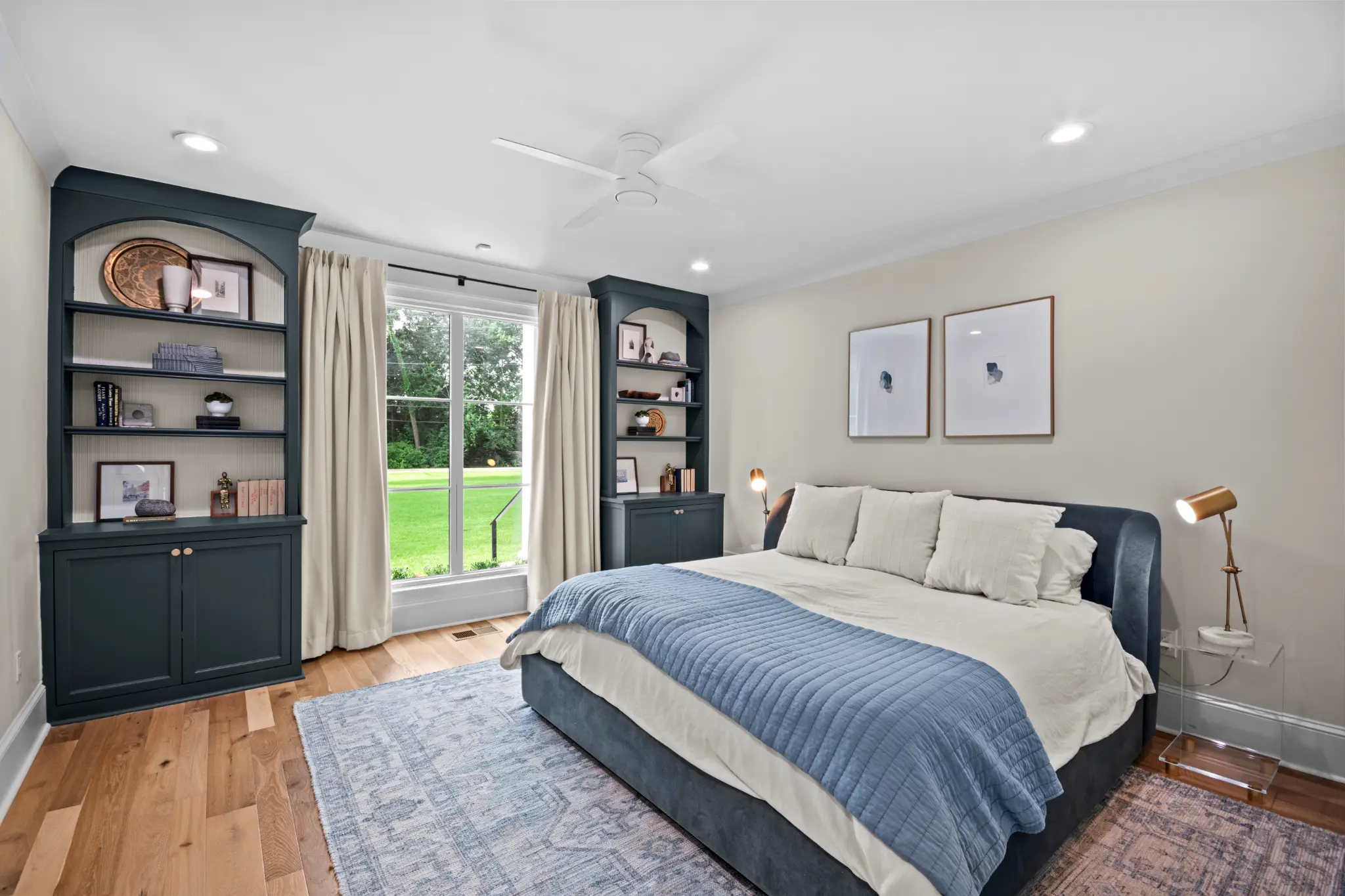The primary bedroom with garden light and custom millwork