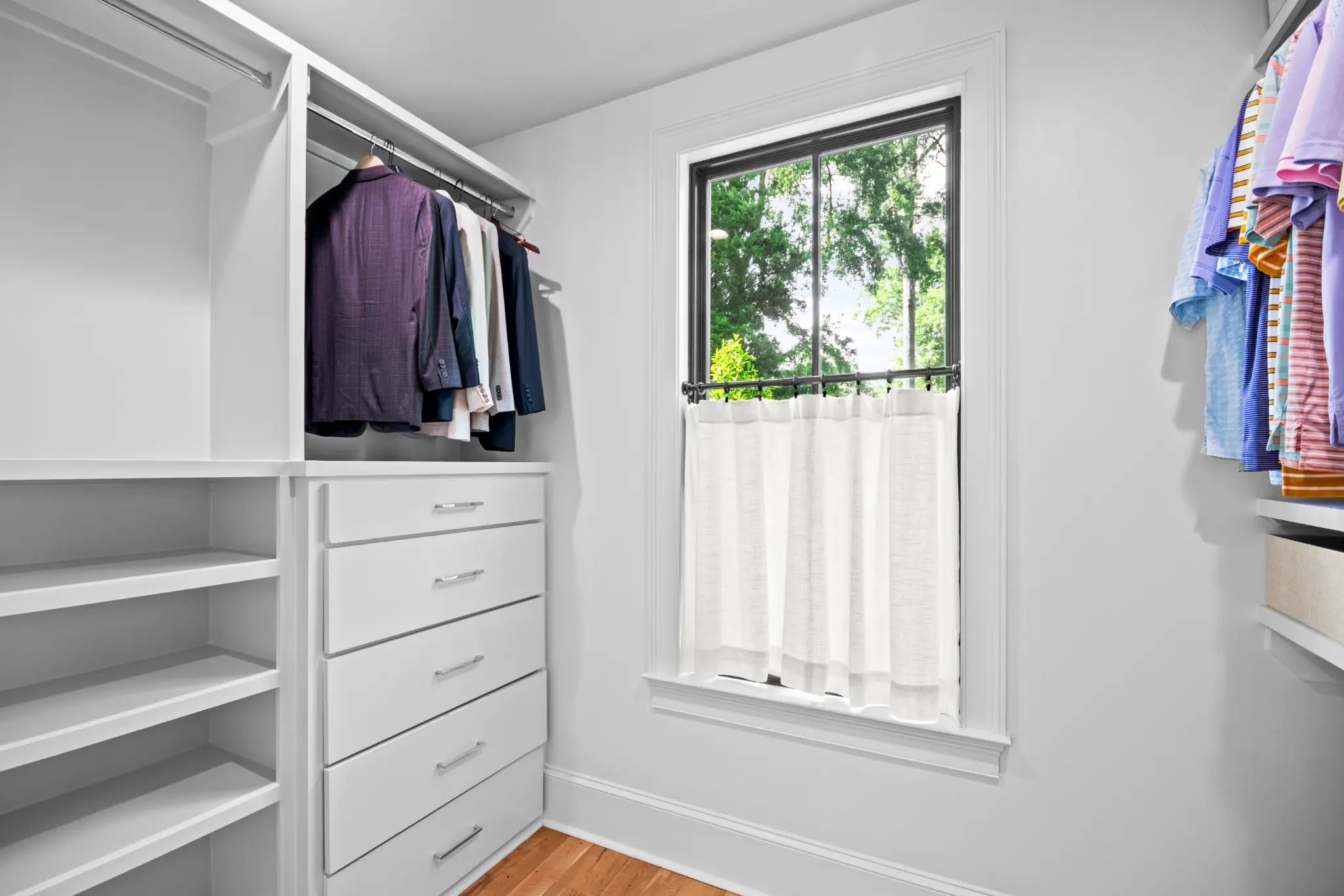 A custom walk-in closet in the primary suite